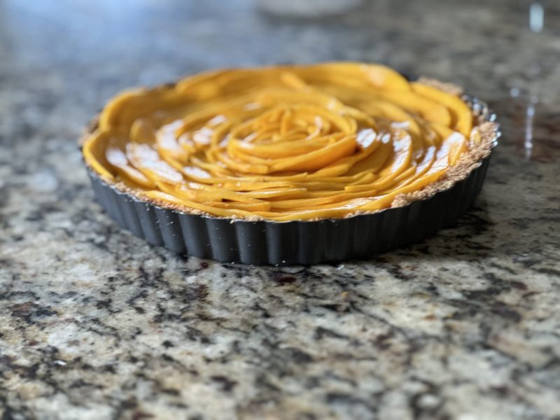 Custom gluten-free mango tart arranged like a rose